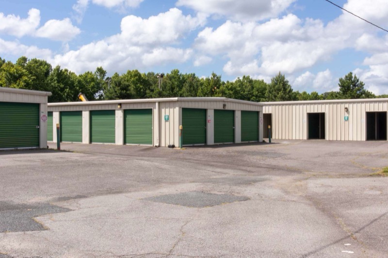 Rows of drive-up storage units with roll-up doors at Portsmouth Storage Depot